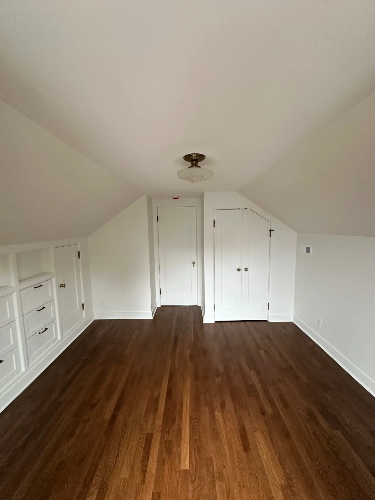 Completed upper bedroom with built-in storage