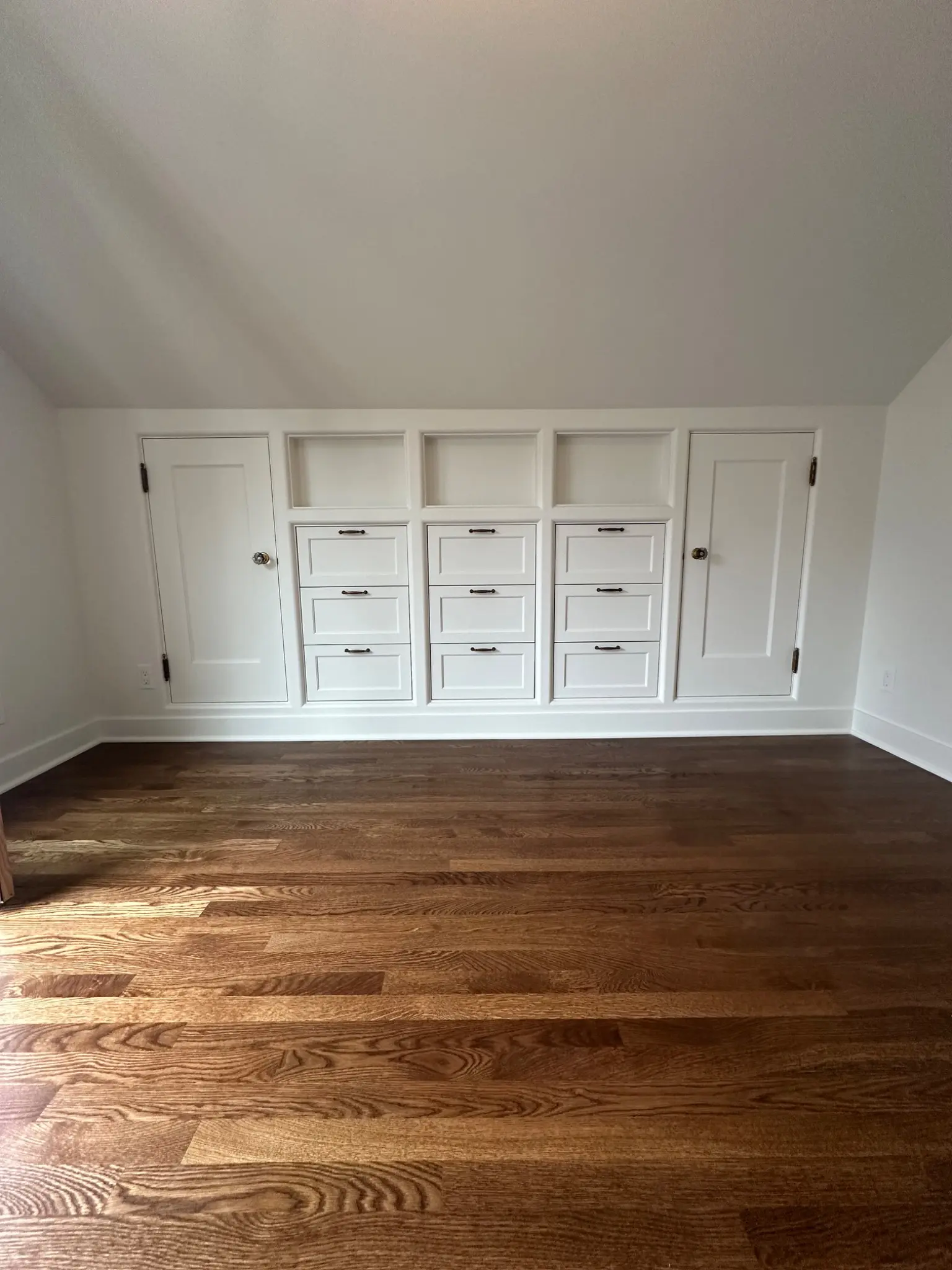 Built-in drawers fitted beneath the sloping roof