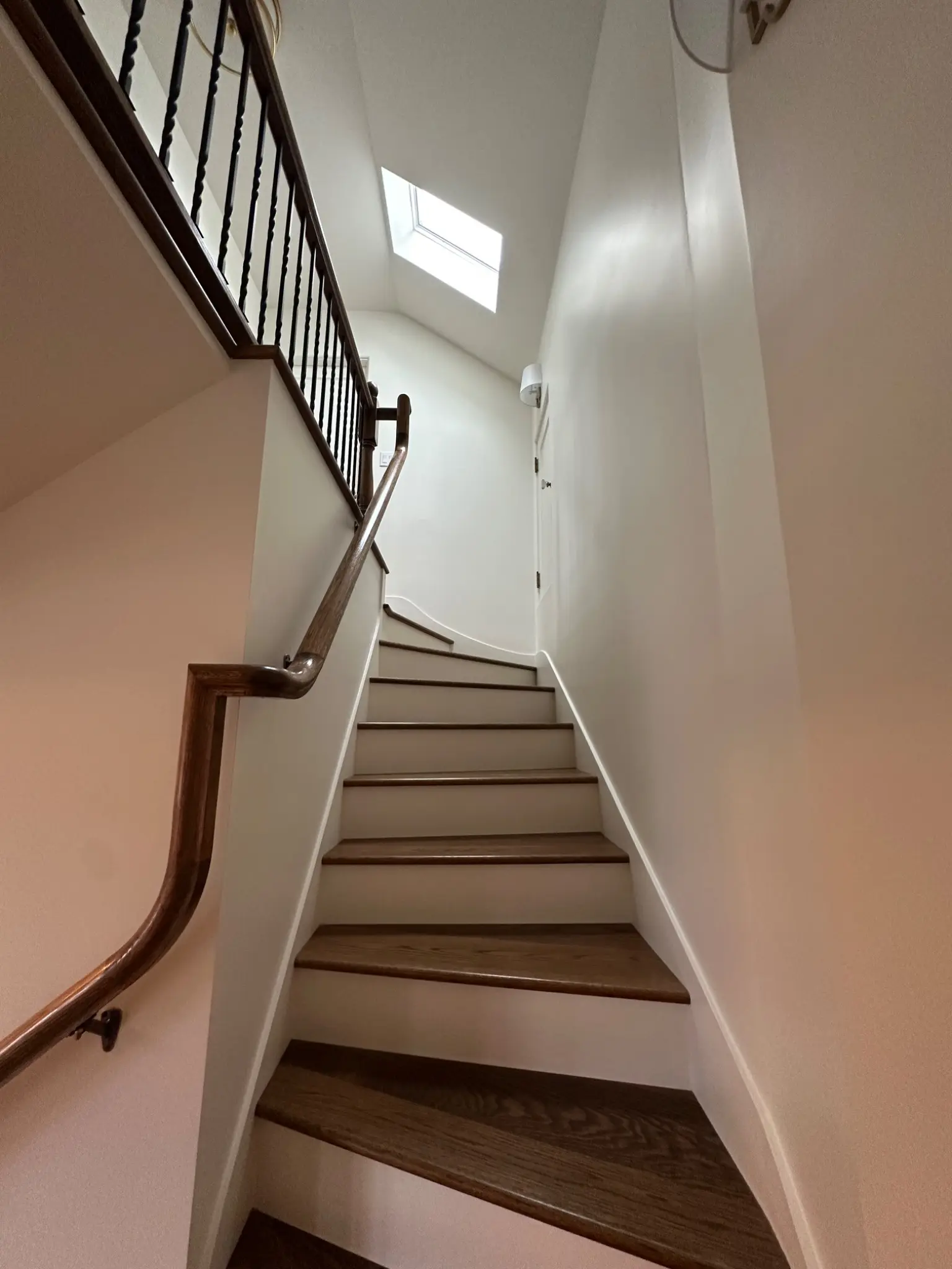 Winder staircase rising to the new upper floor
