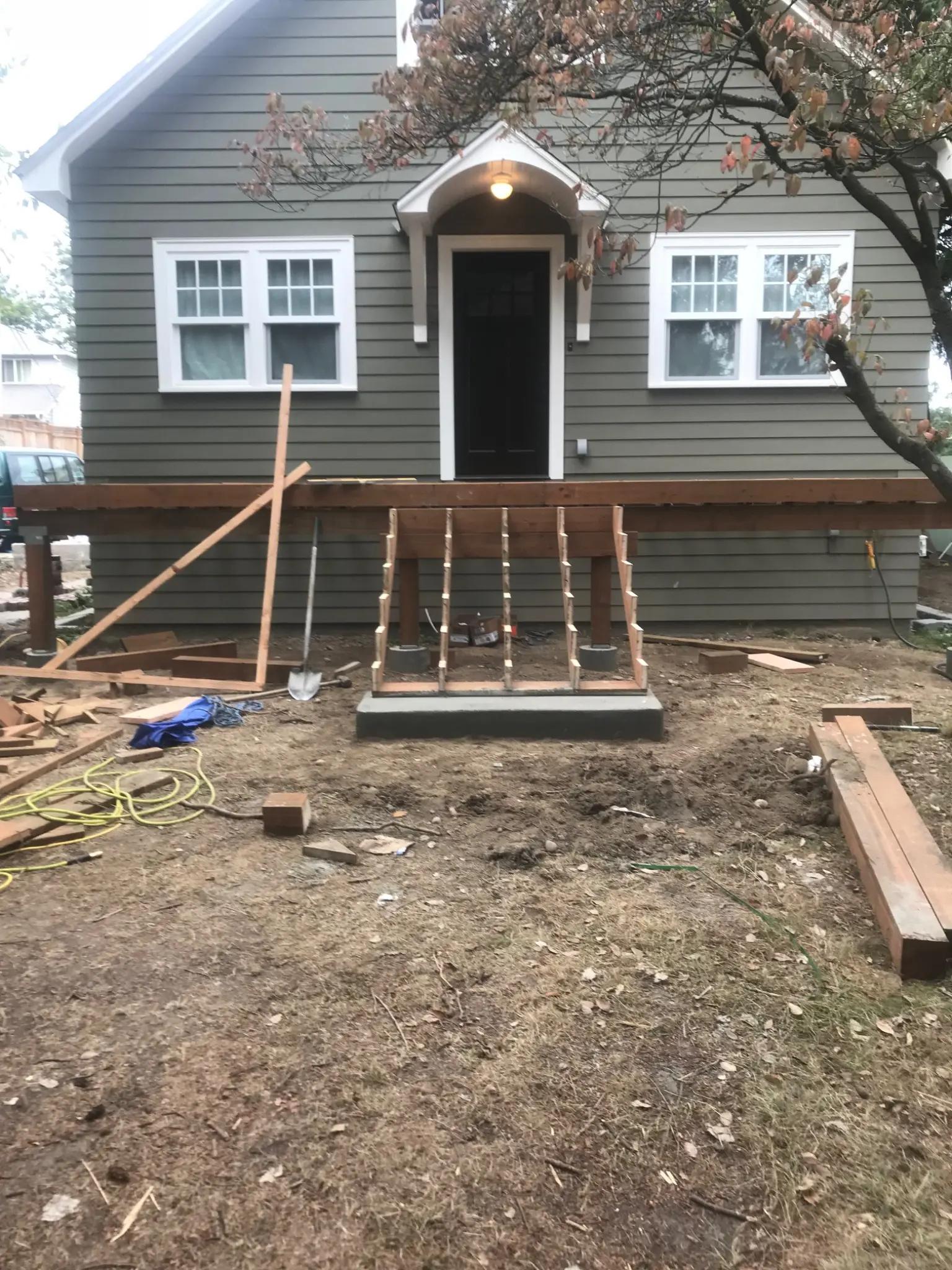 Front porch railing and stairs taking shape