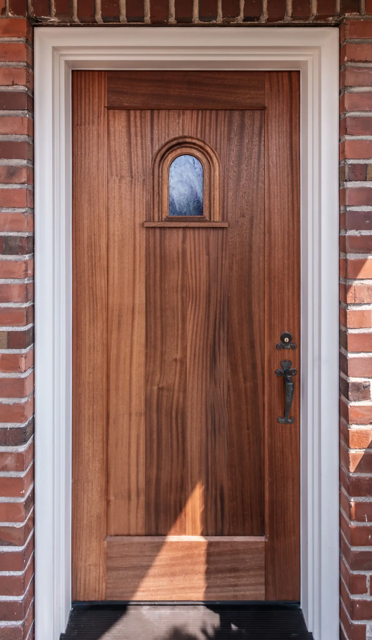 Custom front entry door incorporating the original speakeasy