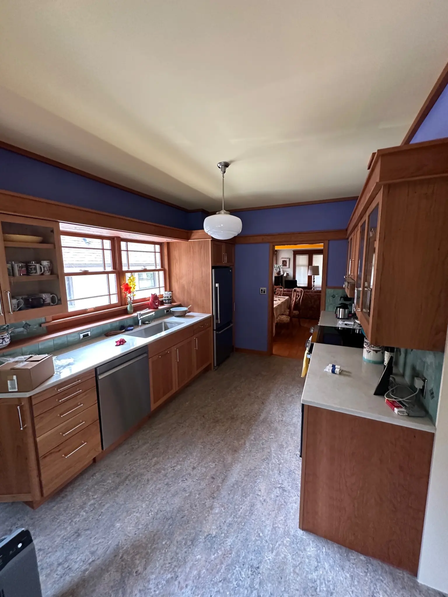 Wide view of the completed Craftsman kitchen and custom cabinetry