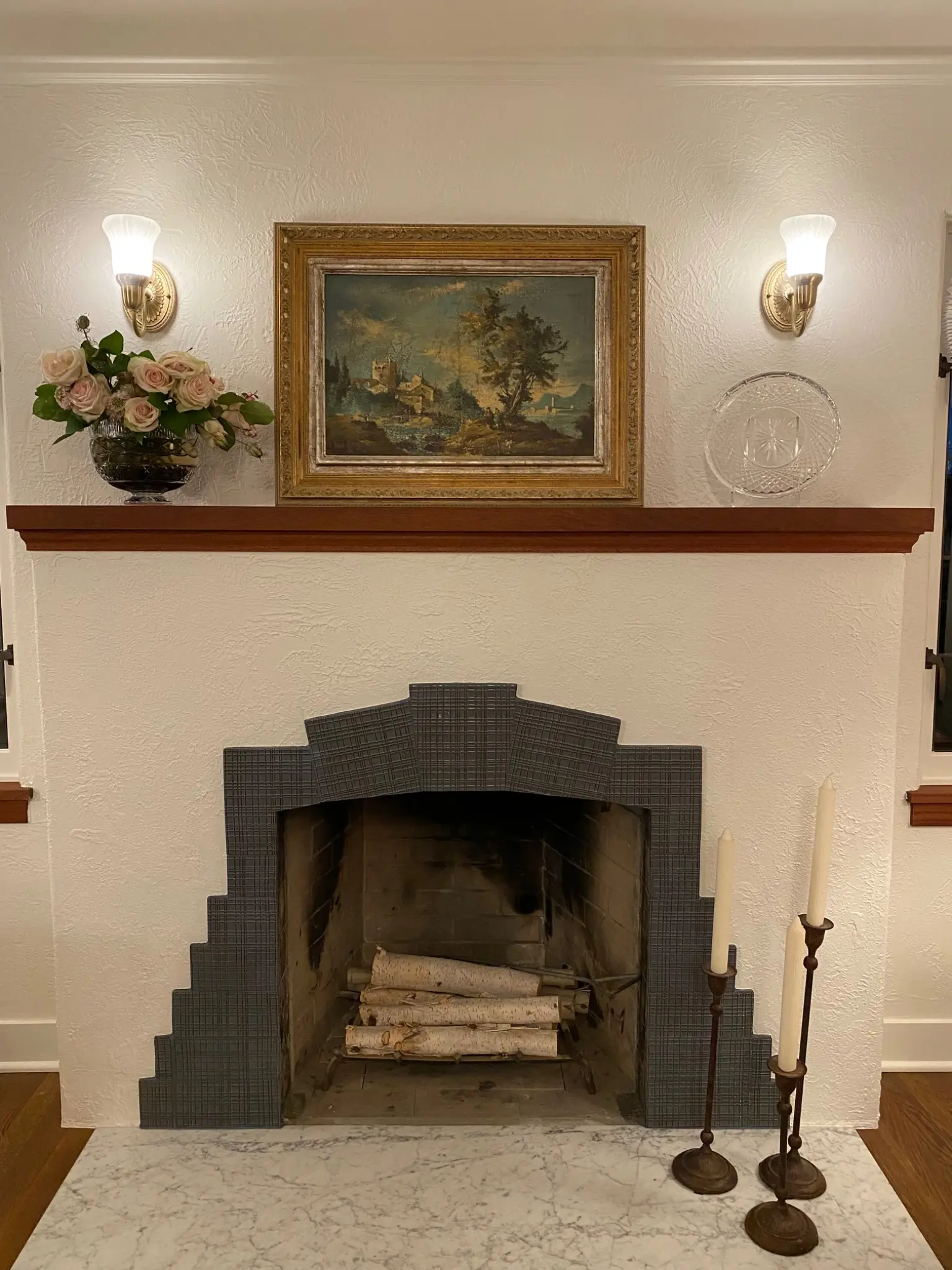 Restored living-room fireplace with period tile and mantel
