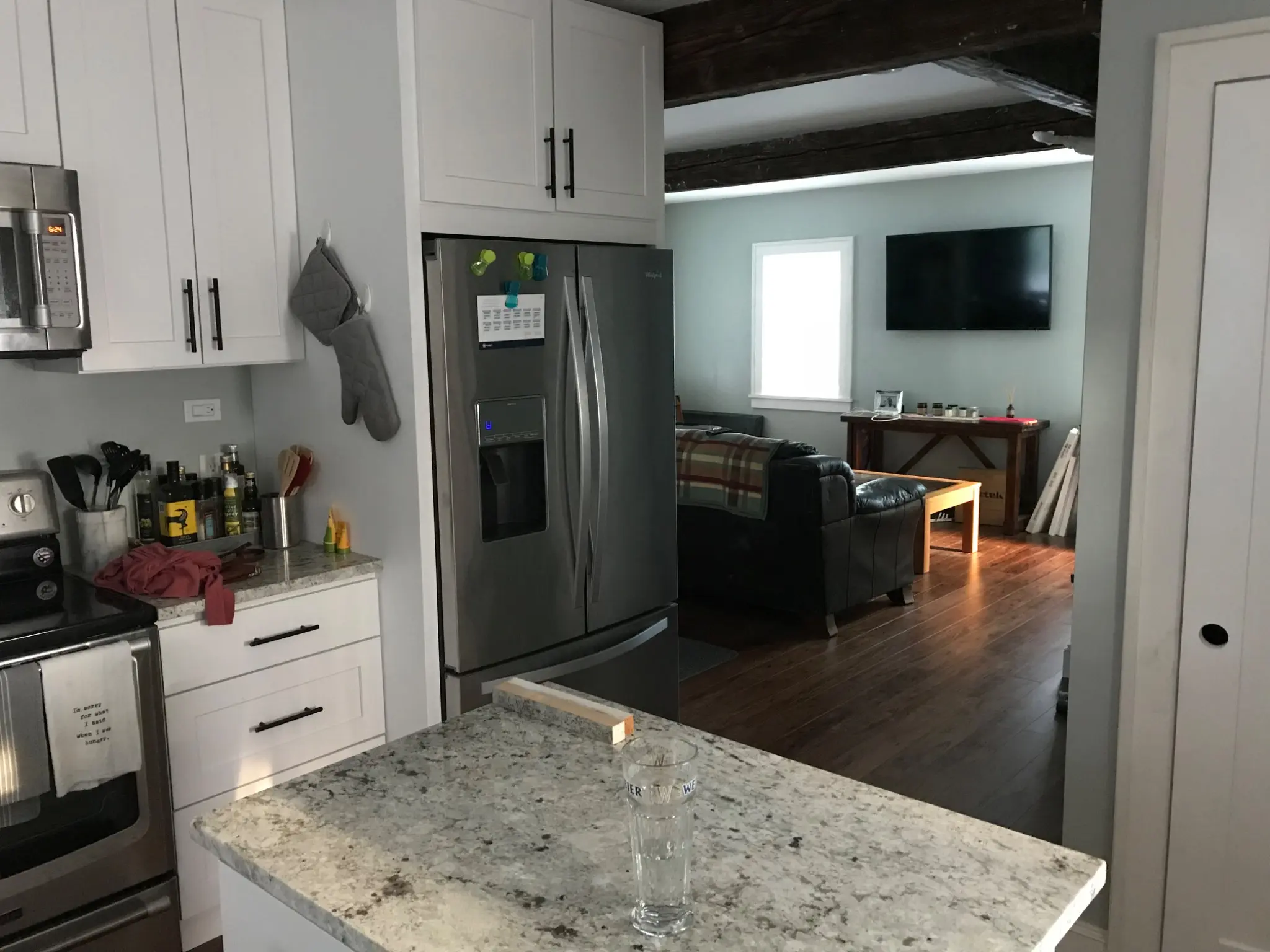 Completed kitchen opening into the living area
